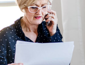 woman-on-the-phone-asking-about-final-arrangements-for-grandmother