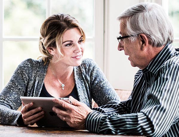 woman-talking-with-her-aging-dad-about-retirement-plans